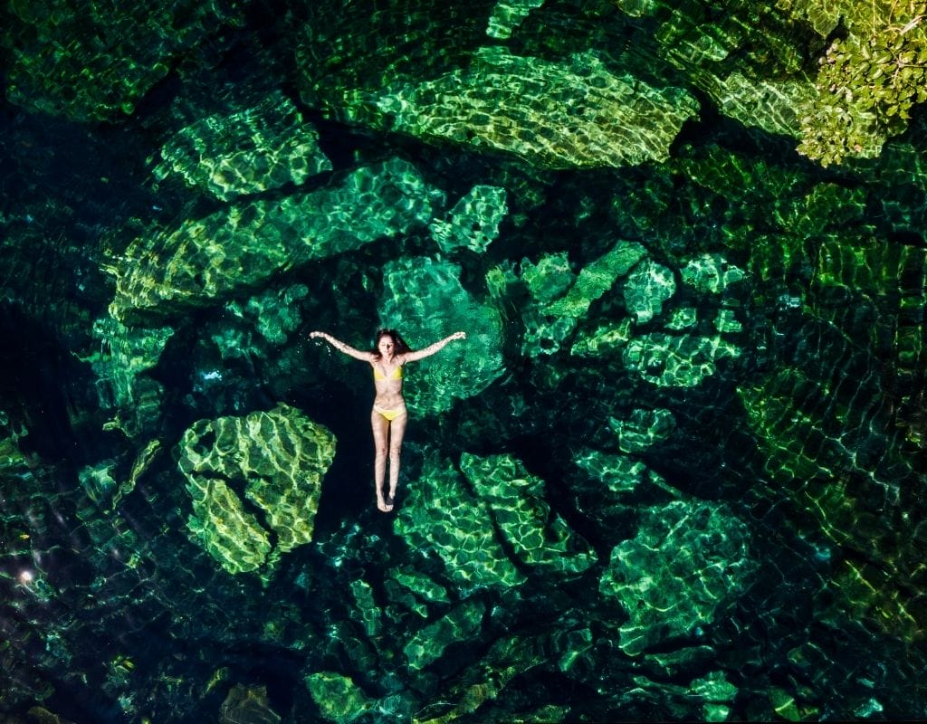 Cenote cristalino girl floating 