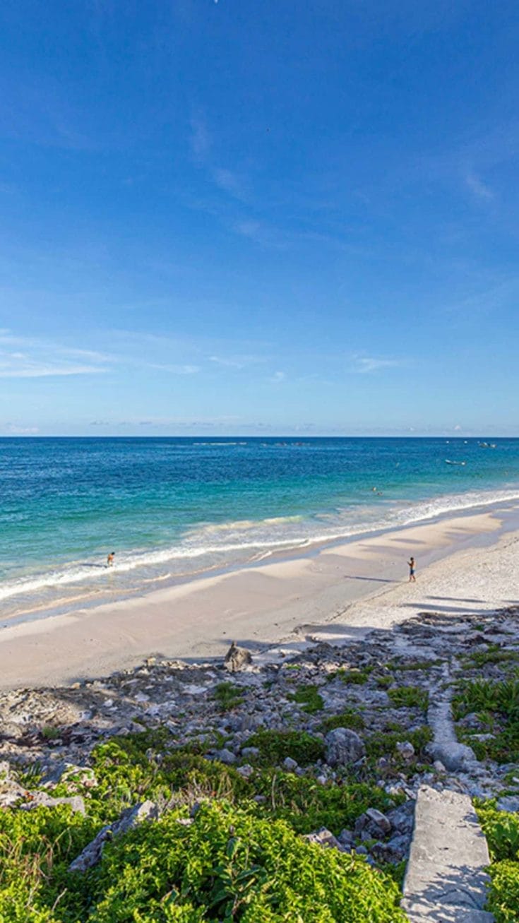 Things to do in Tulum - a girl walking on the beach 